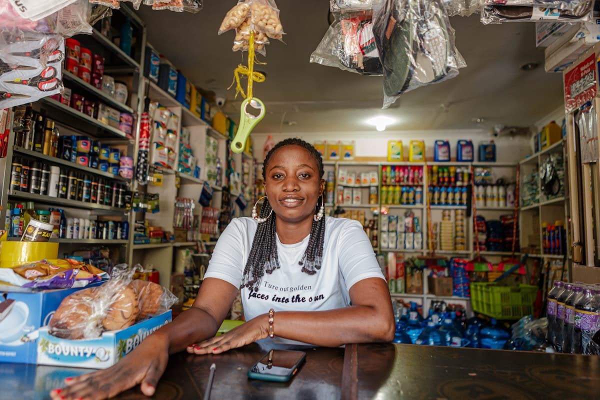 African businesswoman posing inside her small shop