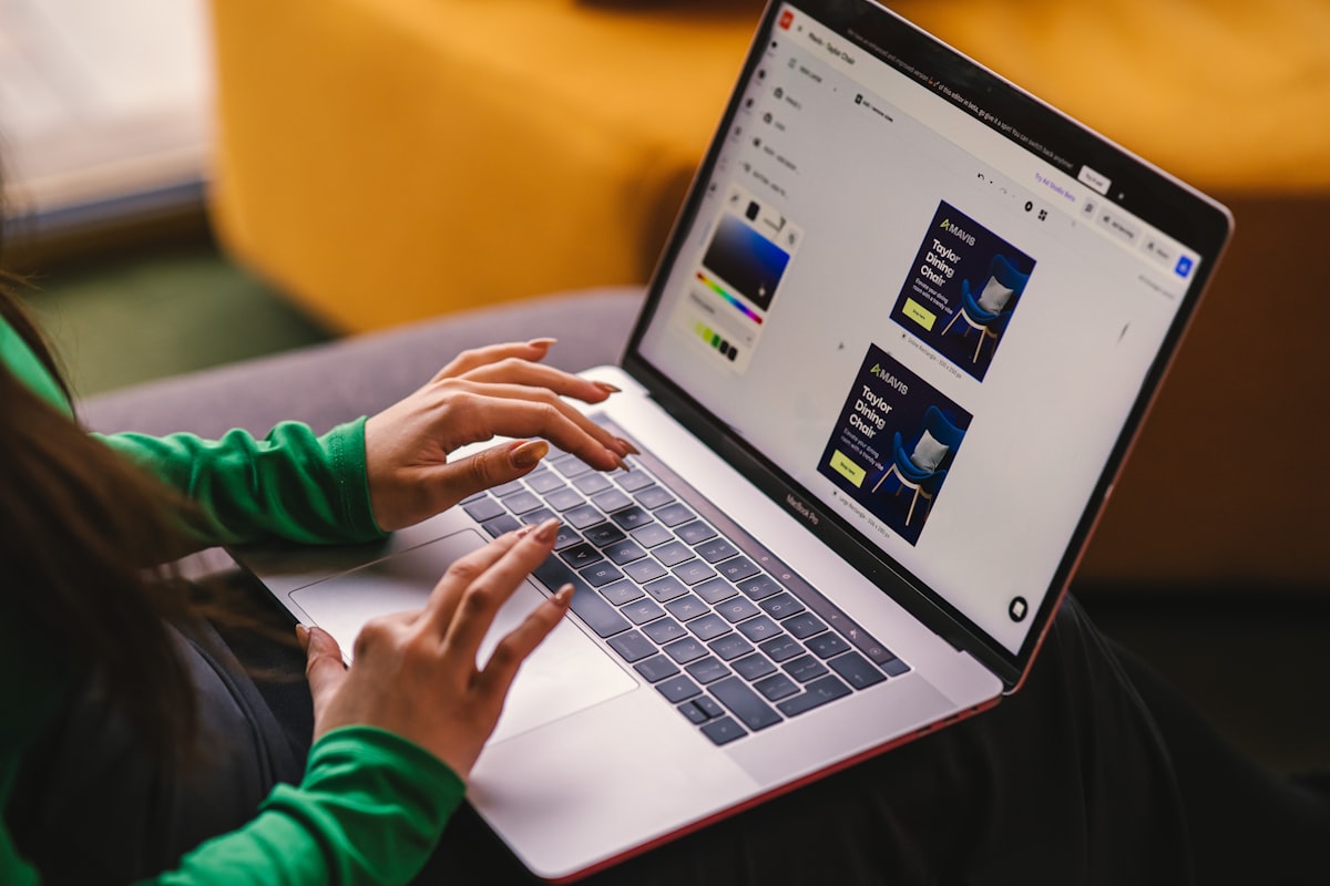 A woman working on Creatopy - The Ad Automation Platform, and designing a set of banners.