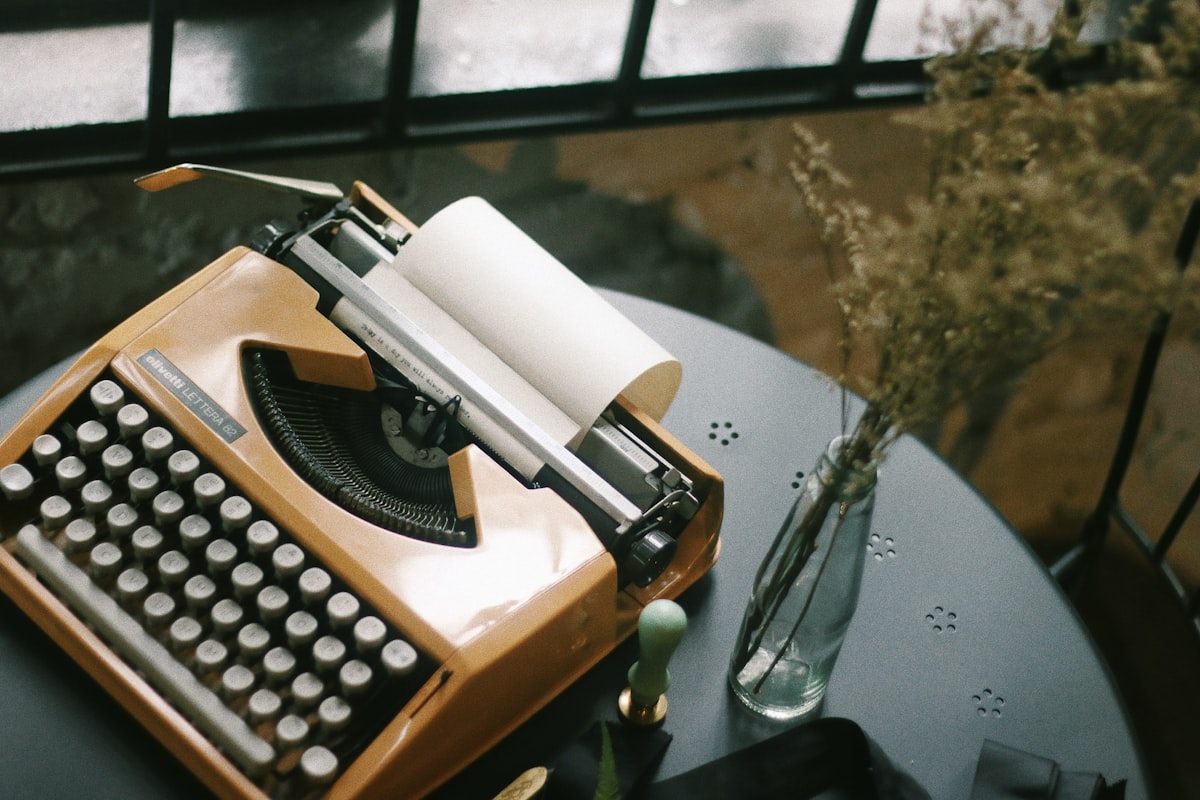 Vintage typewriter for typing. Styled desk with dried flowers & a wax seal stamp.